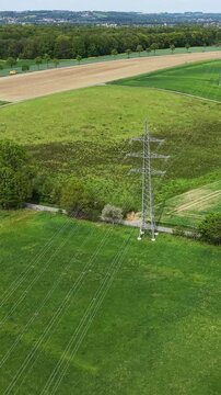 High voltage power lines crossing rural landscape