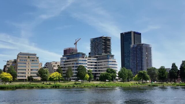 A hyper laps street view of buildings in the city of Amsterdam beside the main train station  on a sunny summer noon in the Netherlands