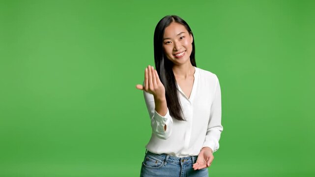 Friendly asian woman gesturing come here invitation isolated on green screen background