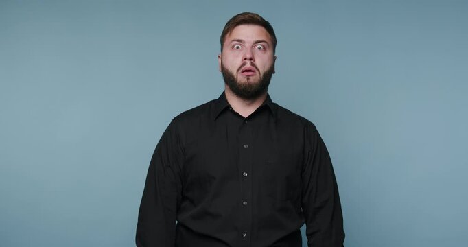 Surprised man shows different reactions to what he sees in a simple setting