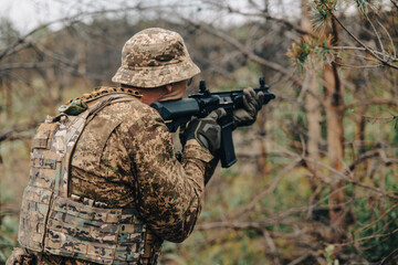 Fototapeta premium Soldier Aiming Sniper Rifle in Tactical Gear During Military Operation Outdoors