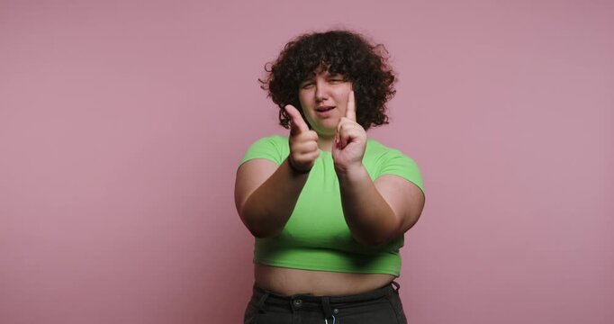 Person shows different hand gestures and expressions in a colorful setting