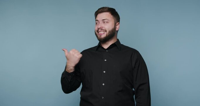 Man performs gestures while speaking to express ideas in a studio setting