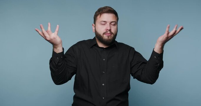 Man expressing various emotions and thoughts with hand gestures in a simple room at daytime