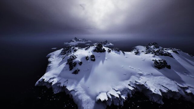 aerial snowbound cape dotted with dark rocks, soft light and low contrast, quiet sea margins and textured snowdrifts, contemplative mood suitable for editorial