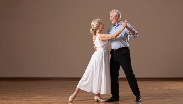 Elegant elderly couple in formal wear share a slow dance on a wooden dance floor