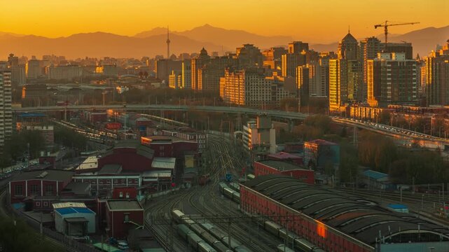 Beijing Skyline at Sunset with Urban Railway Tracks and Mountains in Beijing, China