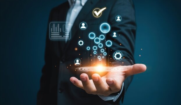 Businessman holding hologram of business icons for data management and quality control concept.