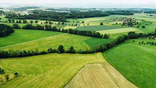 Panoramic aerial view of green rolling hills and farmland in Germany