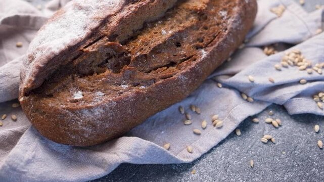 Freshly baked rye bread loaf rotating