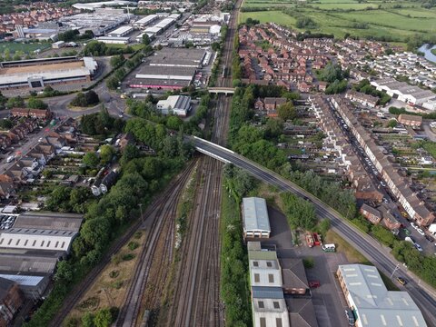 Aerial drone 4K view of town and river with natural green banks Burton on Trent