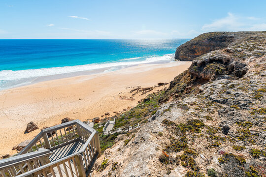 Boardwalk leading from Ethel Wreck Beach Lookout toward the remains of historic shipwreck in Innes National Park, South Australia. Clear daylight highlights the coastal cliffs, ocean, and rugged shore