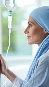 Cancer patient with IV drip receiving chemotherapy treatment in hospital, healthcare and illness recovery, emotional strength and hope, woman in medical setting, support for cancer survivors