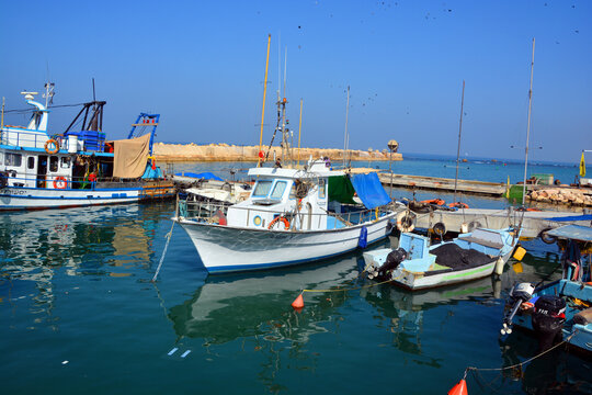 JAFFA ISRAEL: Fishing boats over Mediterranean sea at old Jaffo marina. the ancient port, historical city of the Middle East