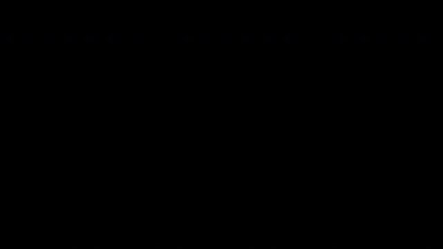 Small flickering fire flame isolated on a pitch black background.