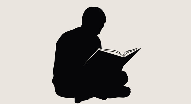 Silhouette of a man sitting and reading a book.