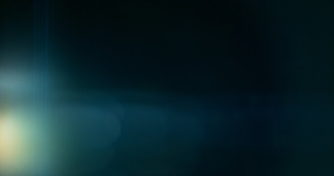 Anamorphic lens flare and light leak effect on dark background. Minimal cinematic optical texture ideal for overlays, film production, motion graphics and visual effects.