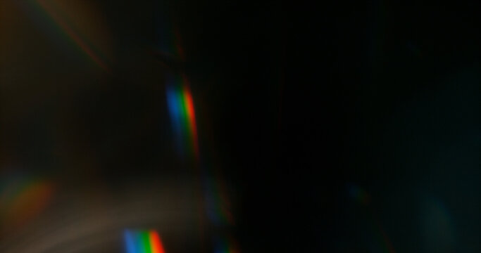 Abstract cinematic lens flare with soft bokeh circles and subtle light reflections. Atmospheric optical effect background ideal for overlays, visual effects, film production and creative design.