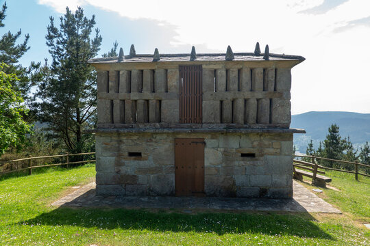 An old stone horreo granary building located in the area of ​​the San Roque viewpoint, in Viveiro, province of Lugo, Galicia, Spain.