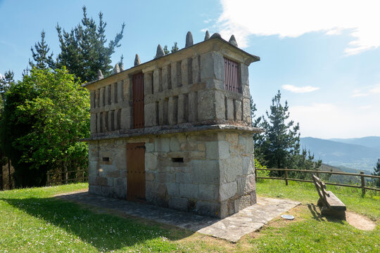 An old stone horreo granary building located in the area of ​​the San Roque viewpoint, in Viveiro, province of Lugo, Galicia, Spain.