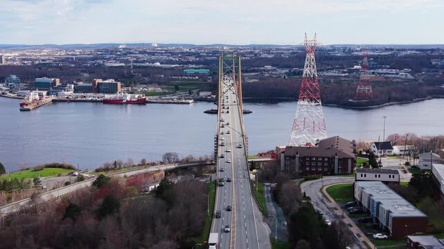 Explore breathtaking aerial views of the A. Murray MacKay Bridge, showcasing its elegant architecture and the vibrant waters surrounding Halifax and Dartmouth