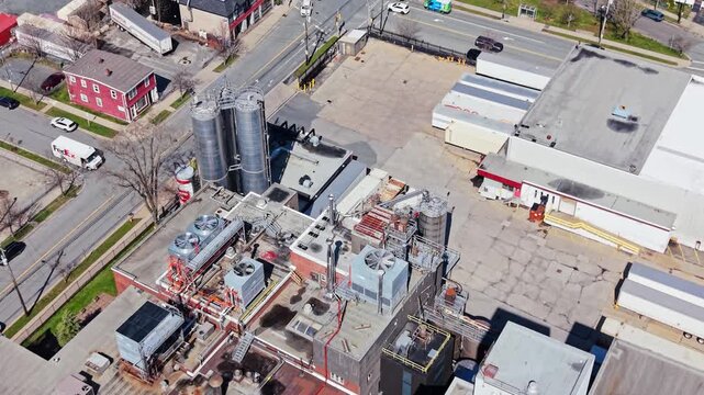 A stunning aerial view reveals the bustling Labatt Brewing Co Ltd in Nova Scotia. Observe the intricate layout of brewing equipment and the surrounding area