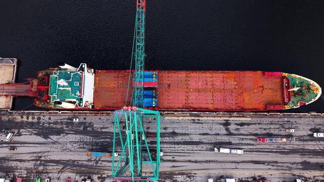 Experience the vibrant energy of a container port in Nova Scotia, with towering cranes, massive ships, and colorful containers working together harmoniously