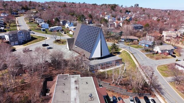Above the library in Halifax, solar panels glisten under the warm sun, symbolizing a commitment to sustainable energy. Explore this eco-friendly initiative in Nova Scotia