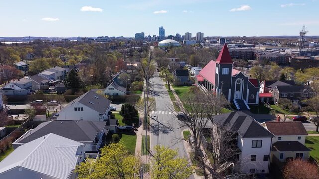 Witness the stunning aerial perspectives of St. Stephen Church soaring above Halifax, revealing neighborhoods and vibrant city life on a clear day