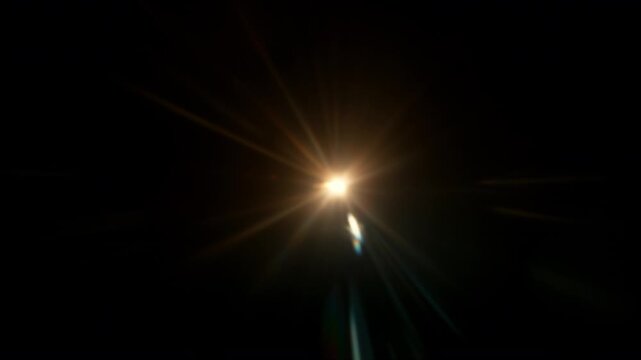 Real Warm Lens Flare Overlay Isolated on Black Background at 1000fps Slow Motion.