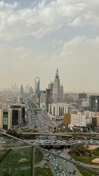 Riyadh skyline with Al Faisaliah and Kingdom Tower, King Fahd Road KSA.High-angle panoramic view of Riyadh city cityscape, featuring iconic skyscrapers, modern urban architecture, and heavy traffic on