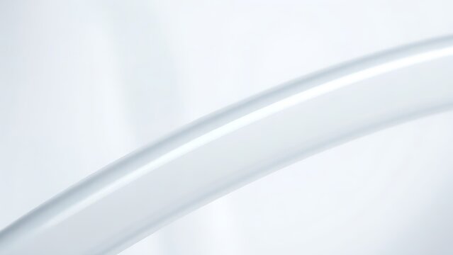 Extreme close-up of a smooth, translucent silicone tube with a light reflection.