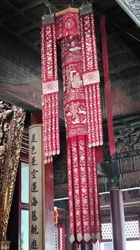 Beijing, China - May 10, 2026: Yunhegong Tibetan Buddhist Temple, Lamaist Temple. Red decorative hanging lantern with intricate designs inside Yunhegong Tibetan Buddhist Temple, showcasing cultural ar