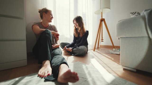 Mother and teenage daughter having a heartfelt conversation at home
