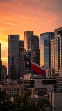 Texas flag waving over a modern city skyline 