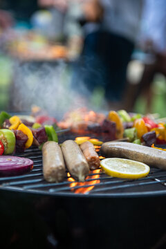 Grilled sausages with vegetables outdoors