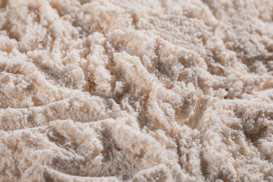 Close-up macro texture of zinc oxide (ZnO) nanopowder, showing fine white particles and porous structure. Concept for nanotechnology, materials science, chemistry, and research.