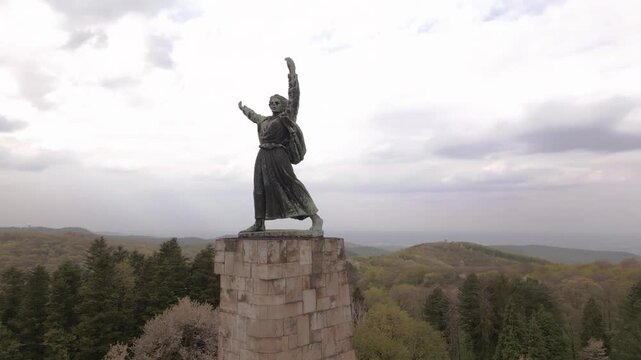 Cinematic drone shot of Freedom Monument on Iriski Venac, Fruska Gora. Aerial video of the iconic Yugoslav WWII spomenik memorial statue surrounded by lush green forests.Fruska Gora,Serbia 16.04.2026