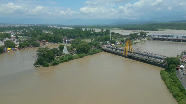 The majestic aerial view captures Haridwar's core: the sacred Har Ki Pauri ghat on the Ganges, the colossal Lord Shiva Statue, and the hilltop Mansa Devi Temple