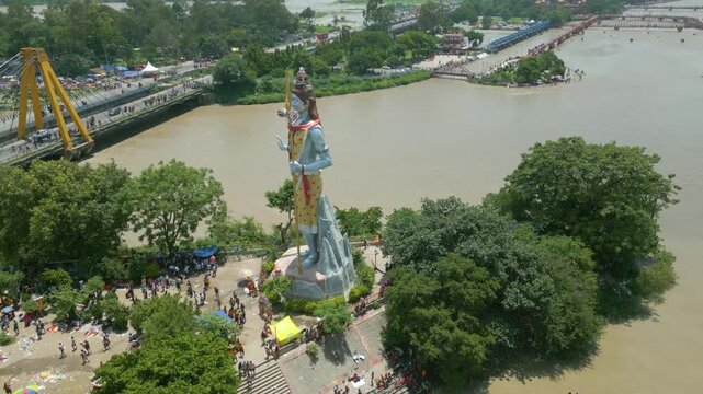 The majestic aerial view captures Haridwar's core: the sacred Har Ki Pauri ghat on the Ganges, the colossal Lord Shiva Statue, and the hilltop Mansa Devi Temple
