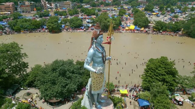 The majestic aerial view captures Haridwar's core: the sacred Har Ki Pauri ghat on the Ganges, the colossal Lord Shiva Statue, and the hilltop Mansa Devi Temple