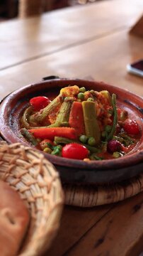 slow motion pan shot of boiling moroccan vegetarian tajin, Morocco experience