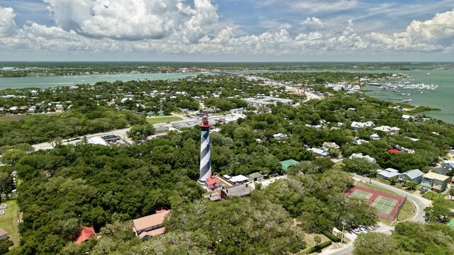 Aerial view of the St. Augustine Lighthouse with its iconic black and white spiral stripes on Anastasia Island in St. Johns County, Florida, United States.
