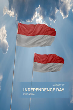 Two flags of Indonesia in blue sky with clouds for National holiday