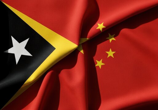 Waving flags of east timor and china, representing the diplomatic relationship and cooperation between the two countries