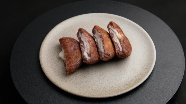 Young coconut filled coconut pancake,Young coconut Bha Bin with black glutinous rice flour.
