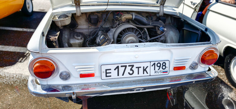 Saint Petersburg, Russia - May 23, 2026: Zaporozhets car engine view with open trunk, showcasing mechanical components and license plate in a parking area