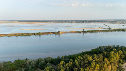 Obraz premium Aerial view Guadalquivir river flowing through rice fields