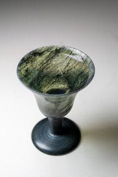 Two vintage translucent jadeite 'Moonlight Cups' on a white background.