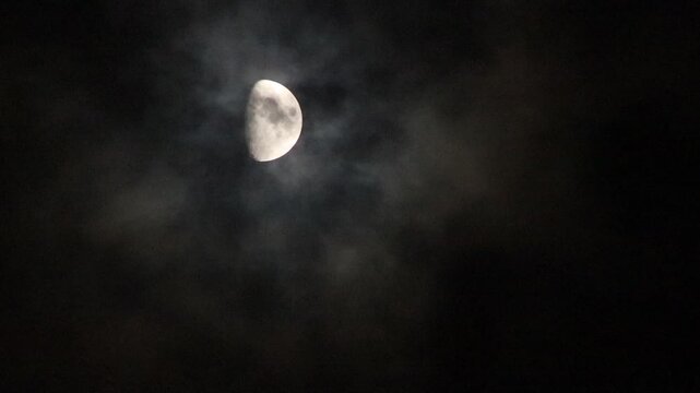 half moon and clouds at night